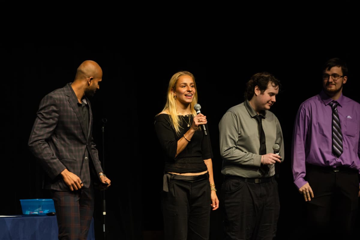 Student team pitching on stage